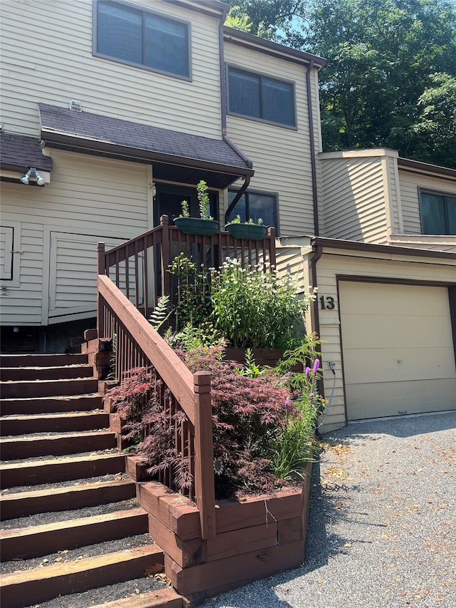 13 Butternut Ct, Highland Mills, NY 10930 - wooden deck with driveway, a garage, and stairway