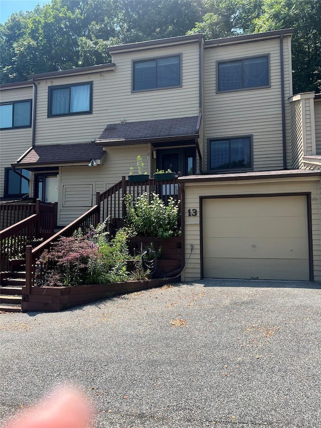 13 Butternut Ct, Highland Mills, NY 10930 - view of property with an attached garage, stairs, and driveway