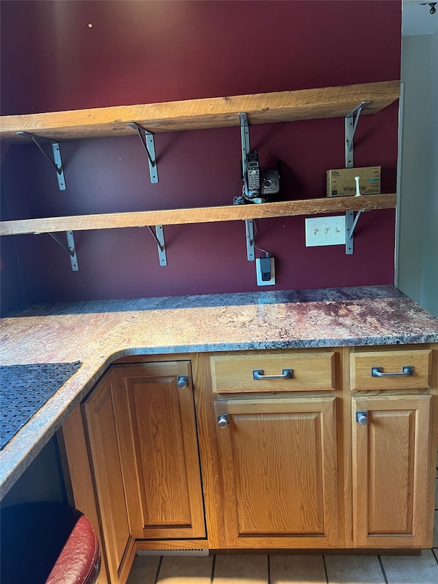 13 Butternut Ct, Highland Mills, NY 10930 - kitchen view of stone countertops, open shelves, and brown cabinets