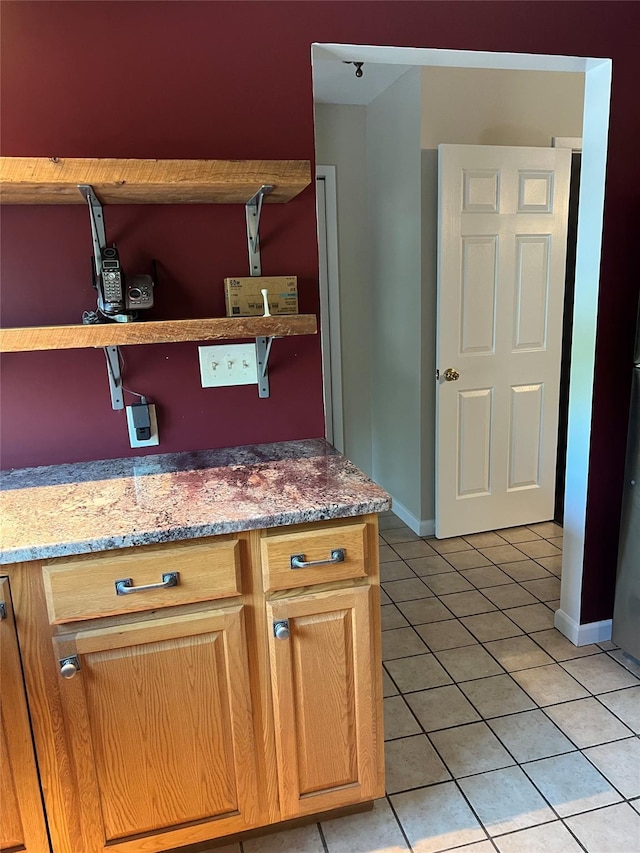13 Butternut Ct, Highland Mills, NY 10930 - kitchen featuring light tile patterned floors, open shelves, and stone countertops