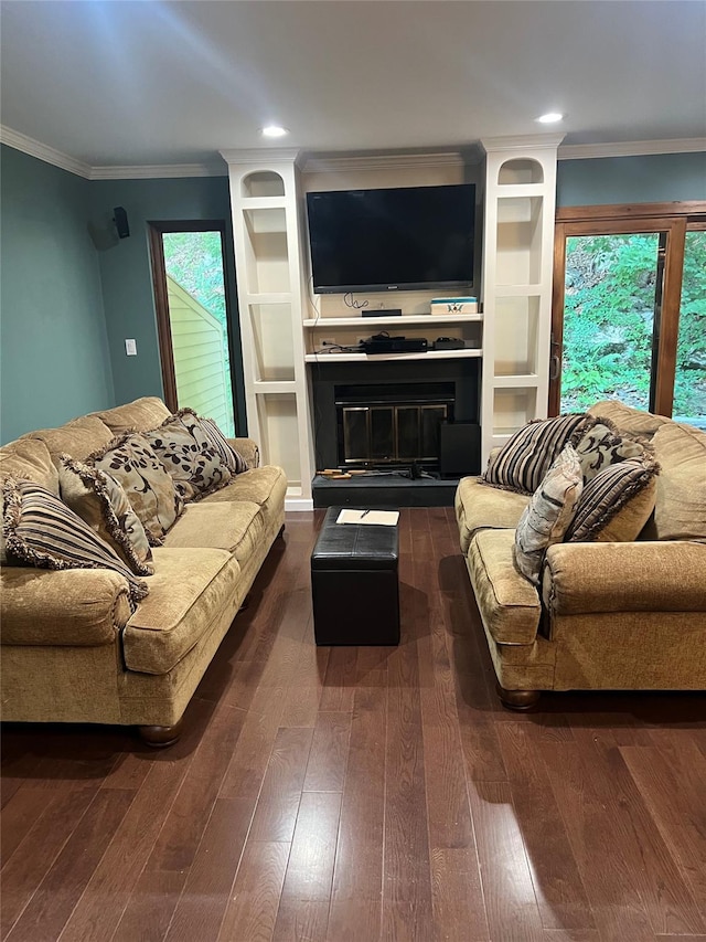 13 Butternut Ct, Highland Mills, NY 10930 - living room featuring a glass covered fireplace, crown molding, dark wood finished floors, recessed lighting, and built in shelves