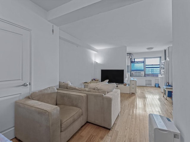 99-05 63rd Dr Unit 7R, Rego Park, NY 11374 - living area with light wood-style flooring and cooling unit