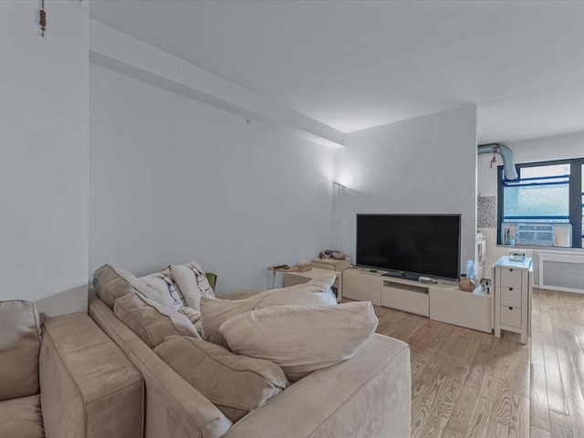 99-05 63rd Dr Unit 7R, Rego Park, NY 11374 - living area with light wood finished floors and cooling unit
