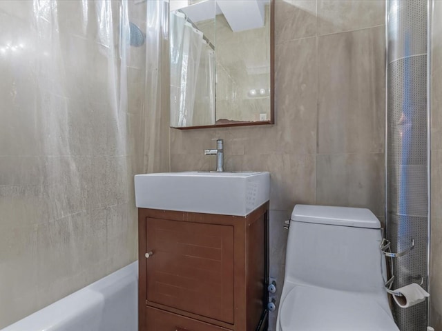 99-05 63rd Dr Unit 7R, Rego Park, NY 11374 - full bathroom featuring tile walls, vanity, and shower / bath combo