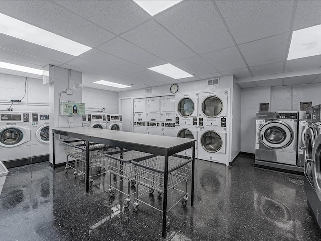 99-05 63rd Dr Unit 7R, Rego Park, NY 11374 - community laundry room with separate washer and dryer and stacked washing machine and dryer