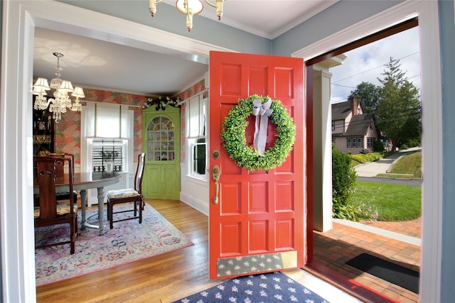 71 Hillcrest Ave, Manhasset, NY 11030 - entryway with a chandelier, crown molding, and wood finished floors