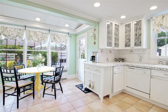 71 Hillcrest Ave, Manhasset, NY 11030 - kitchen featuring white dishwasher, ornamental molding, decorative backsplash, white cabinetry, and recessed lighting