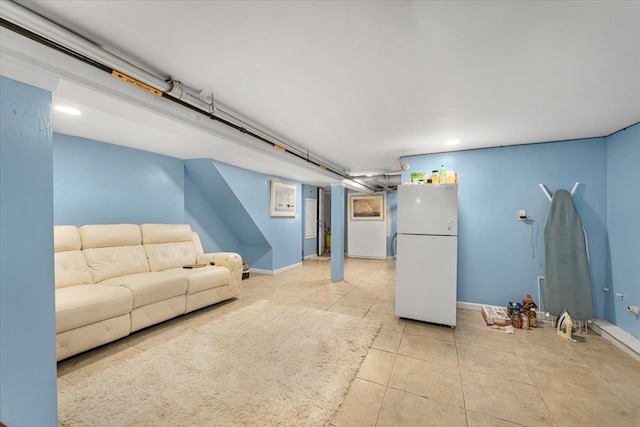 1047 Trinity Ave, Bronx, NY 10456 - living room with light tile patterned flooring and baseboards