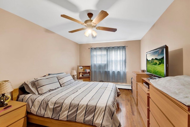 1455 Kennellworth Pl, Bronx, NY 10465 - bedroom featuring light wood-style floors, a baseboard radiator, and a ceiling fan