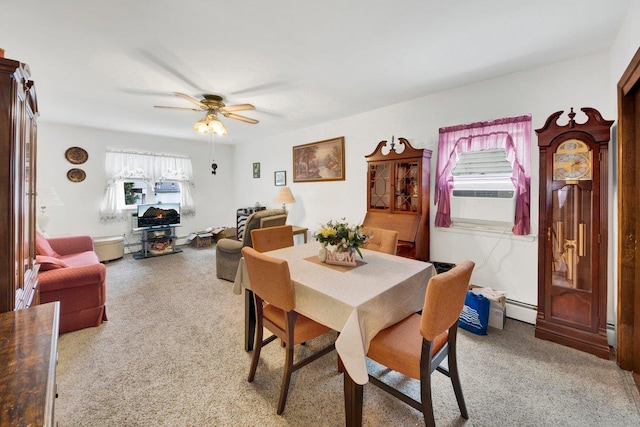 1455 Kennellworth Pl, Bronx, NY 10465 - dining room featuring light carpet, a ceiling fan, and baseboard heating