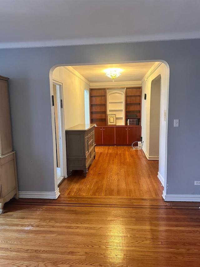 118-14 83rd Ave Unit 2E, Kew Gardens, NY 11415 - hallway featuring arched walkways and light wood-type flooring