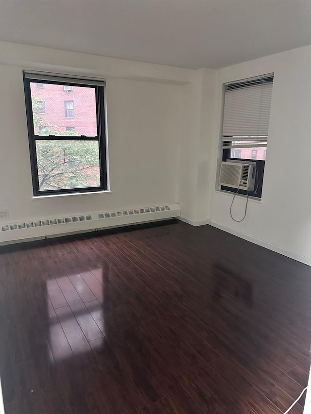 6145 98th St Unit 5J, Rego Park, NY 11374 - empty room featuring a baseboard radiator, dark wood-type flooring, and cooling unit