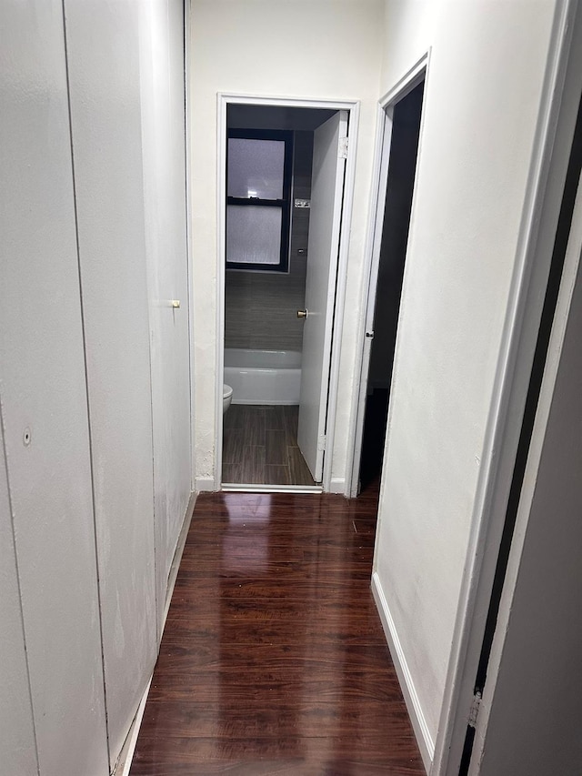 6145 98th St Unit 5J, Rego Park, NY 11374 - hallway featuring wood finished floors and baseboards
