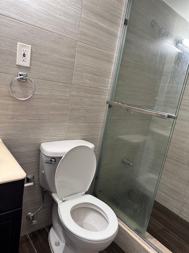 6145 98th St Unit 5J, Rego Park, NY 11374 - full bathroom with a stall shower, vanity, and tile walls