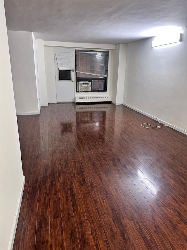 6145 98th St Unit 5J, Rego Park, NY 11374 - unfurnished living room featuring wood finished floors, cooling unit, and a baseboard radiator
