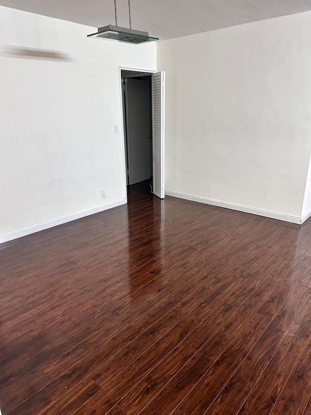 6145 98th St Unit 5J, Rego Park, NY 11374 - spare room featuring dark wood-style floors and baseboards