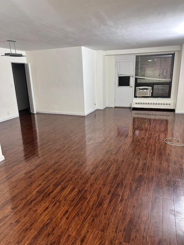6145 98th St Unit 5J, Rego Park, NY 11374 - unfurnished living room featuring wood finished floors, a baseboard radiator, and cooling unit