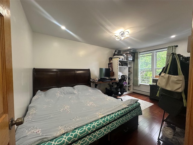 313 88th St, Brooklyn, NY 11209 - bedroom featuring dark wood-style floors and a baseboard radiator