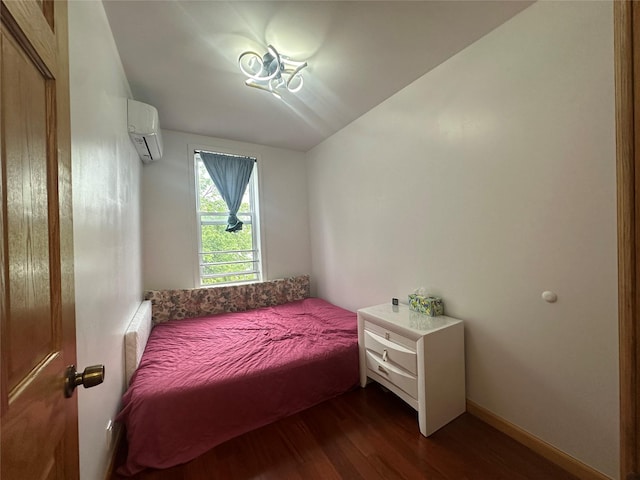 313 88th St, Brooklyn, NY 11209 - bedroom with a wall unit AC, dark wood-style flooring, and vaulted ceiling