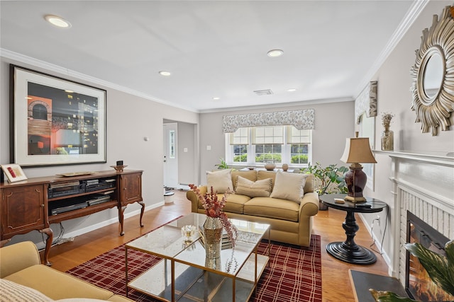 15 Shadetree Ln, Stony Brook, NY 11790 - living room featuring wood finished floors, a fireplace with flush hearth, recessed lighting, and crown molding