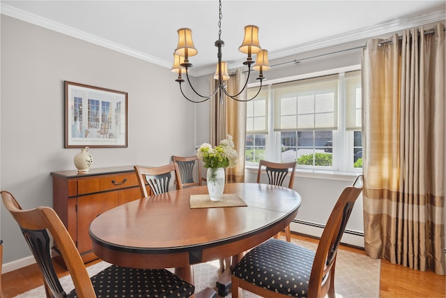 15 Shadetree Ln, Stony Brook, NY 11790 - dining room featuring ornamental molding, a chandelier, light wood-style flooring, and a baseboard radiator