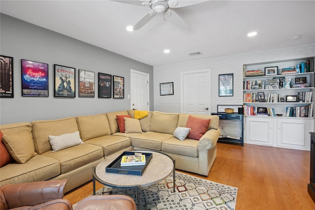 15 Shadetree Ln, Stony Brook, NY 11790 - living area with ceiling fan, wood finished floors, recessed lighting, and brick wall