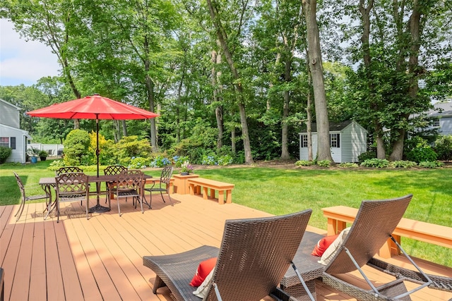 15 Shadetree Ln, Stony Brook, NY 11790 - wooden terrace featuring a storage unit, outdoor dining space, and a yard