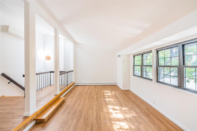 3-06 121st St, College Point, NY 11356 - empty room with a baseboard heating unit and wood finished floors