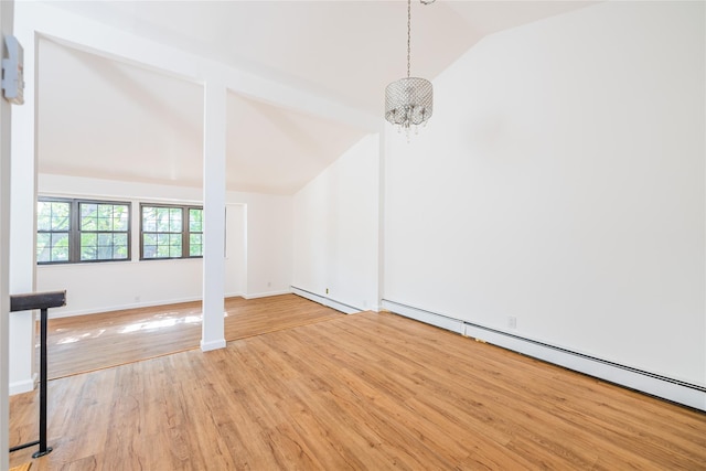 3-06 121st St, College Point, NY 11356 - empty room featuring vaulted ceiling, a baseboard radiator, light wood-style floors, and a baseboard heating unit