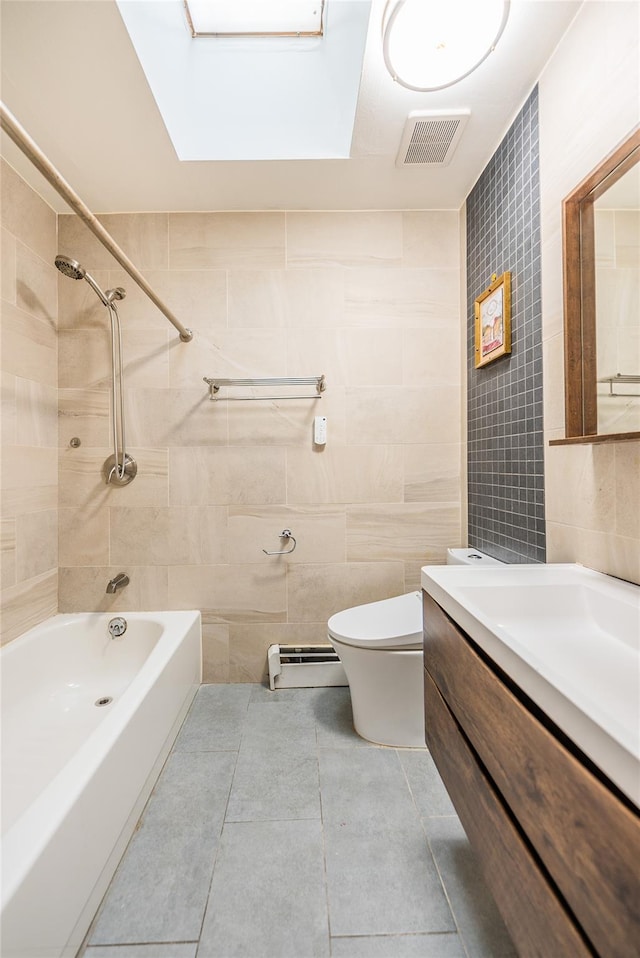 3-06 121st St, College Point, NY 11356 - bathroom featuring tile walls, vanity,  shower combination, a skylight, and a baseboard radiator
