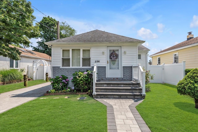 596 Lincoln Ave, West Hempstead, NY 11552 - view of front of property featuring stone siding, a gate, and a shingled roof
