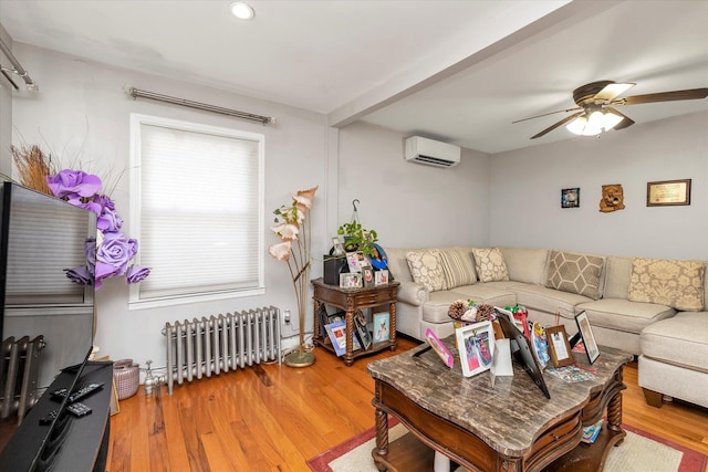 596 Lincoln Ave, West Hempstead, NY 11552 - living area with radiator heating unit, a wall mounted AC, wood finished floors, ceiling fan, and recessed lighting
