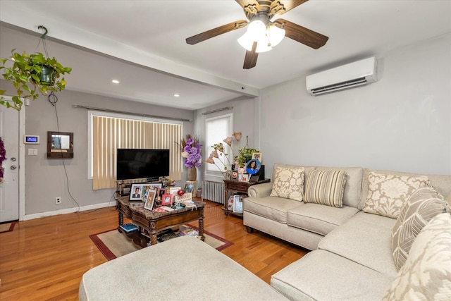 596 Lincoln Ave, West Hempstead, NY 11552 - living room with a wall unit AC, radiator, wood finished floors, recessed lighting, and a ceiling fan