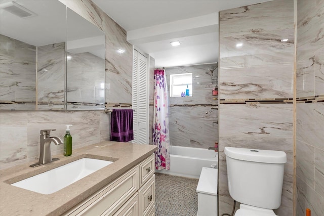 596 Lincoln Ave, West Hempstead, NY 11552 - full bathroom with tile walls, shower / bathtub combination with curtain, and vanity