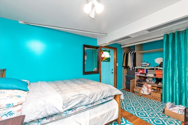 596 Lincoln Ave, West Hempstead, NY 11552 - bedroom with a closet and wood finished floors
