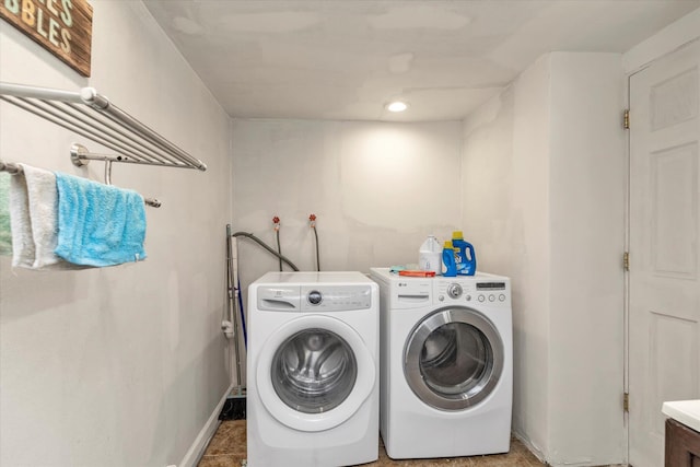 596 Lincoln Ave, West Hempstead, NY 11552 - laundry room with washer and clothes dryer and recessed lighting