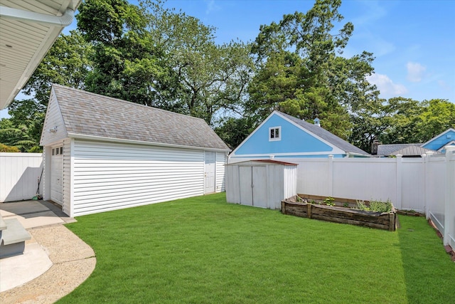 596 Lincoln Ave, West Hempstead, NY 11552 - view of yard with a vegetable garden and a storage unit