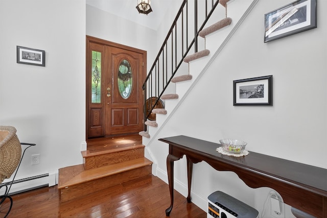 53 Mountain View Dr, Holmes, NY 12531 - entrance foyer with baseboard heating, wood finished floors, and stairway
