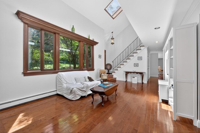 53 Mountain View Dr, Holmes, NY 12531 - living room with stairs, hardwood / wood-style flooring, a skylight, a baseboard radiator, and recessed lighting