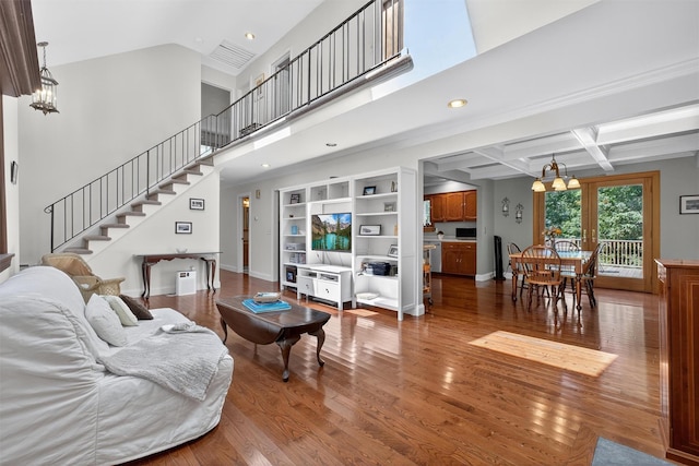 53 Mountain View Dr, Holmes, NY 12531 - living area featuring a chandelier, stairs, wood finished floors, recessed lighting, and coffered ceiling