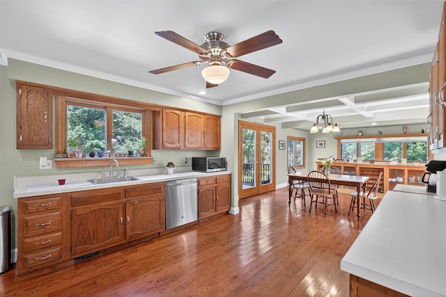 53 Mountain View Dr, Holmes, NY 12531 - kitchen with appliances with stainless steel finishes, brown cabinets, light countertops, wood finished floors, and crown molding