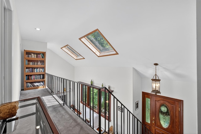 53 Mountain View Dr, Holmes, NY 12531 - hall featuring an upstairs landing, a skylight, carpet floors, lofted ceiling, and recessed lighting