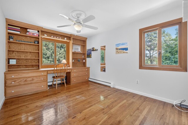 53 Mountain View Dr, Holmes, NY 12531 - office area featuring a baseboard radiator, built in study area, wood finished floors, and a ceiling fan
