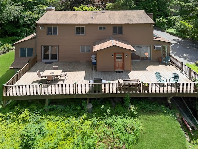 53 Mountain View Dr, Holmes, NY 12531 - rear view of property featuring outdoor dining space, a wooden deck, and a chimney