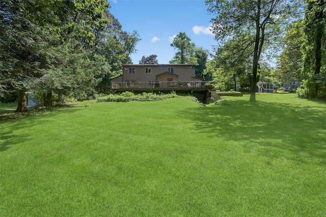 53 Mountain View Dr, Holmes, NY 12531 - view of green lawn with a wooden deck