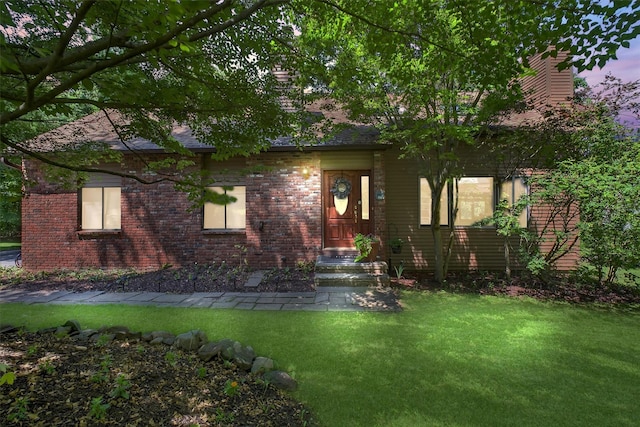 53 Mountain View Dr, Holmes, NY 12531 - view of property hidden behind natural elements with a front lawn, a chimney, and brick siding