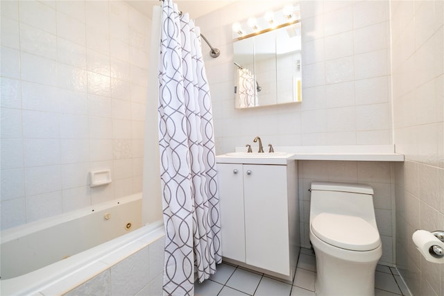 3458 Frederick St, Oceanside, NY 11572 - bathroom featuring tile walls, tile patterned floors, a combined bath / shower with jetted tub, and vanity