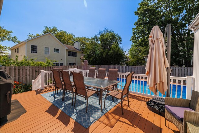 3458 Frederick St, Oceanside, NY 11572 - wooden terrace featuring outdoor dining area and a fenced backyard