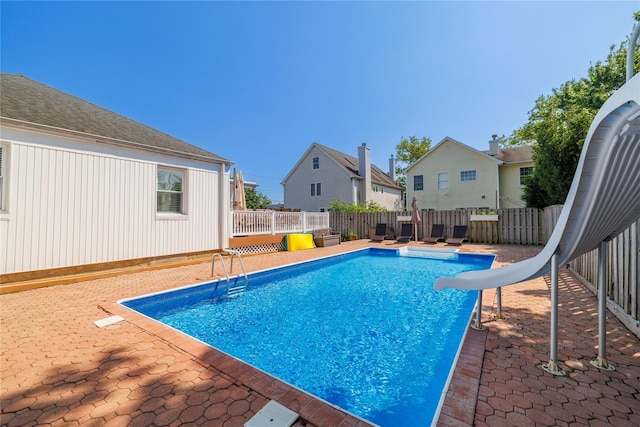 3458 Frederick St, Oceanside, NY 11572 - view of pool with a water slide, a fenced backyard, and a residential view