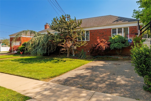 3458 Frederick St, Oceanside, NY 11572 - view of front of property featuring a front lawn and brick siding